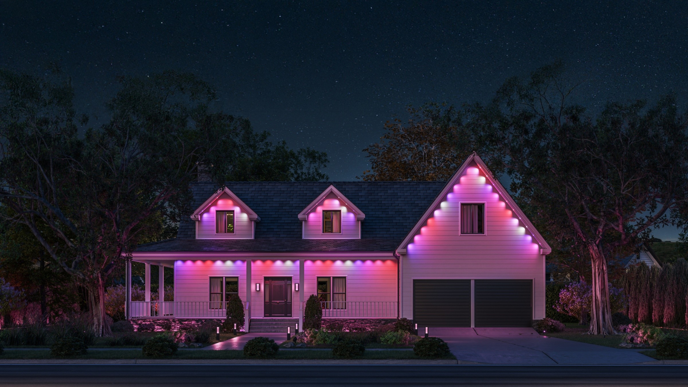 Original Philips Hue Festavia permanent outdoor lights illuminating a house roofline in pink, purple and white