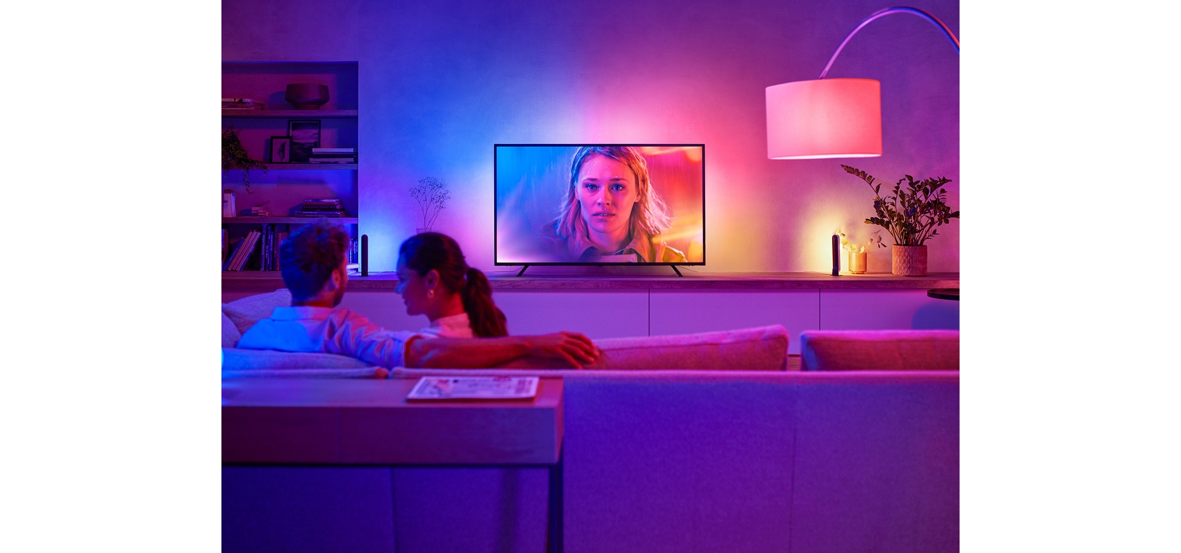 Original Philips Hue Play gradient TV lightstrip lifestyle photograph with ambient blue and pink lighting